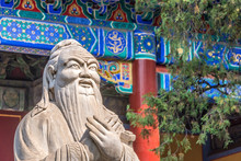 Closeup Of Confucius Statue In Front Of Colorful Ancient Temple With Beautiful Ornaments