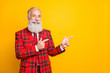 © deagreez - Photo of cool funny grandpa guy indicating fingers empty space salesman wear unusual lumberjack holiday suit red blazer tie outfit isolated yellow color background