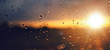 © photoschmidt - Raindrops on a windowpane at sunset panorama