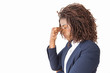 Tired female employee touching face with closed eyes. Young African American business woman posing isolated over white background. Exhaustion or burnout concept