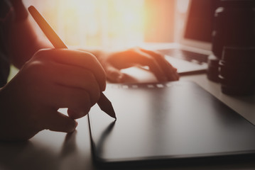 graphic designer artist using graphics tablet