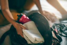 Close Up Of Woman Packing Training Bag
