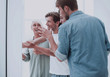 © ASDF - group of employees standing in the office lobby