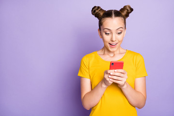 Canvas Print - Photo of funny model lady holding telephone reading positive comment in social blog wear yellow t-shirt isolated on pastel purple background