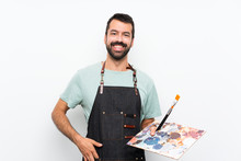 Young Artist Man Holding A Palette Over Isolated Background Laughing