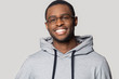 © fizkes - Head shot portrait smiling African American man wearing glasses