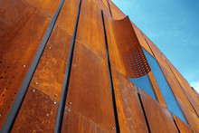 Detail Of A Building Facade Made Of Rusted Metal Blocks. Abstract Architecture. Minimalistic Design.
