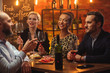 © Nejron Photo - Group of friends having fun talk behind bar counter in a cafe