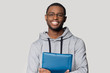 © fizkes - Head shot portrait smiling African American man holding folder