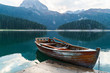© Artem - Mountain lake with coniferous forest, a wooden boat and a pier in the frame. Romantic tourist place. National Park Durmitor, Montenegro, Europe.
