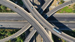 Aerial drone top down photo of urban multilevel highway junction with light traffic