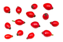 Red rose hips collection isolated on a white background. Fructus cynosbati. Set of single whole rosehips of shiny vibrant look from different angles. Raw ripe fruits full of vitamins and carotenoids.