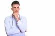 © Ranta Images - Studio shot of young handsome man doctor thinking