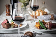 © ahirao - wine glasses on dining table with steak
