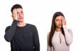 © Ranta Images - Studio shot of young couple both looking tired