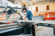 © visualspectrum/Westend61 - Carpenter working with saw in workshop