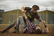 © Karsten Koch/Westend61 - Two men with full beards fighting in abandoned landscape