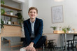 © KNSY/Westend61 - Portrait of confident businesswoman sitting in a cafe