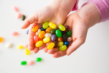 Hands Of Little Girl Holding Jelly Beans