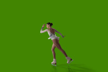 Figure Skating Girl Isolated On Green Background.