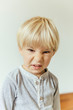 © Mareen Fischinger/Westend61 - Little boy making a rabbit face
