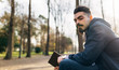 © Marco Govel/Westend61 - Portrait of bearded young man with book in the park