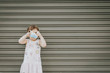 © Cavan Images - girl playing with photo camera