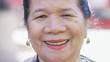 Portrait of happy smiling Filipino female looking to camera with a big grin