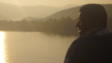 Fototapeta Do akwarium - young boy on lake