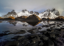 View Of Mountains Of Vestrahorn And Perfect Reflection In Shallow Water.