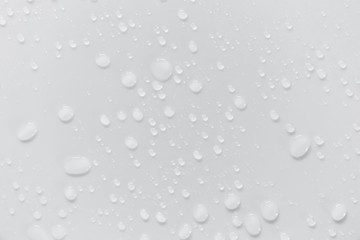 Fototapete - Raindrops on a grayish white background. Rainy season concept.