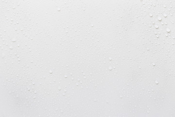 Fototapete - Raindrops on a grayish white background. Rainy season concept.