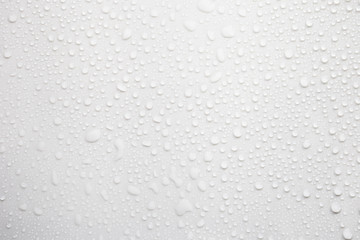 Fototapete - Raindrops on a grayish white background. Rainy season concept.