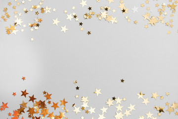 Abstract Christmas background with golden glitter over white board.