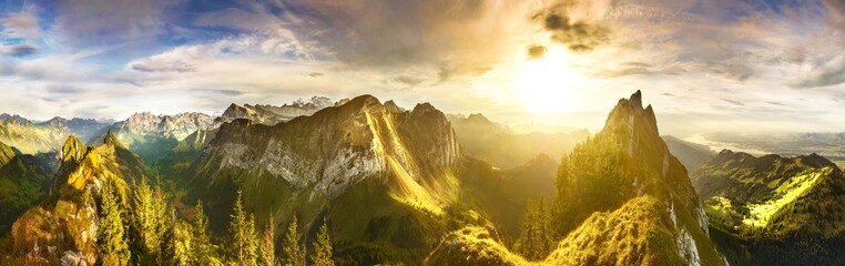 Wall Mural - Panoramic view of Swiss Alps at sunset