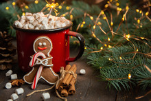 Cocoa Or Hot Chocolate With Marshmallow On Rustic Table. Christmas Or New Year Composition. Gingerbread Man With Candy Cane