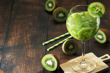 A glass with kiwi cocktail	