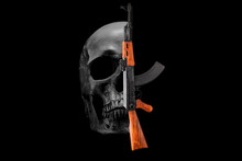 Skull And Assault Rifle AK 47 On A Black Background. War, Crime Concept.