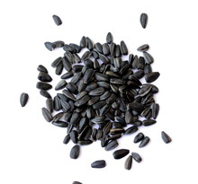 Black Small Sunflower Seeds. Seeds In The Shape Of A Heart And A Month. Handful Of Seeds.