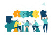 © IRStone - Team of businesspeople talking and making decision. People moving puzzle pieces with questions marks.