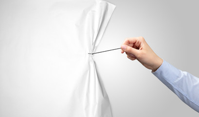 hand pulling white paper curtain, changing scene concept