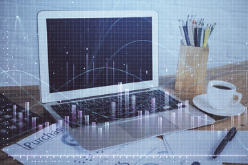 Stock market graph and table with computer background. Multi exposure. Concept of financial analysis.