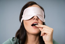 Blindfolded Young Woman Testing Food