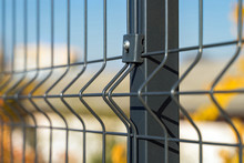 Steel Grating Fence Made With Wire On Blue Sky Background. Sectional Fencing Installation