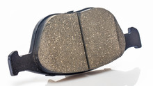 One Brake Pad For Disc Brakes Of A Car On A White Background.