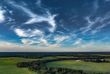 Fototapeta Na ścianę - Cloudy sky over countryside landscape.