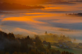 Fototapeta  - Misty sunrise in mountains
