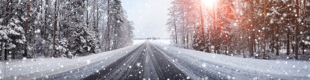 winter road, covered with snow on sunny day - obrazy, fototapety, plakaty 