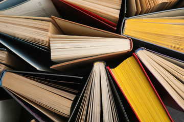 stack of hardcover books as background, top view