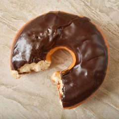 Poster - Chocolate donut with a missing bite